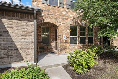 Property entrance featuring brick siding