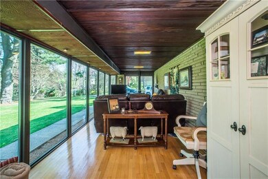 Enjoy hardwood floors and redwood ceilings in the 