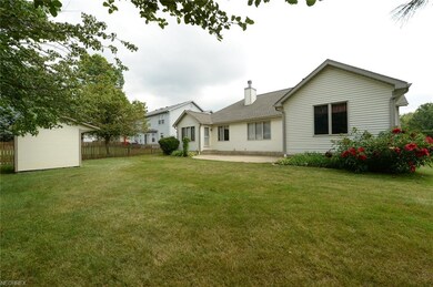 Beautiful backyard with perennials, concrete patio