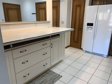 Large breakfast bar. Newer refrigerator included.