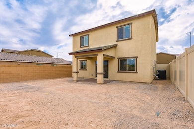 Rear view of house featuring a patio area, a fence