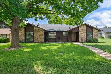 Mid-century inspired home featuring solar panels,