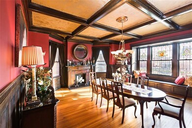 Formal dining room with coffered ceiling, elegant 