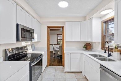 Main level: kitchen with brand new cabinets and all new stainless appliances