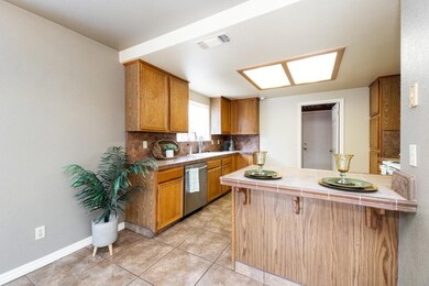 Kitchen has lots of Cupboards, Eating Bar and Entr