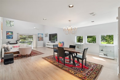 view of dining and family room with green space ou
