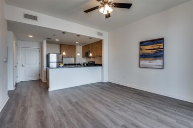 Kitchen with ceiling fan, hanging light fixtures, 