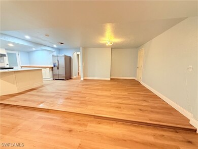 Unfurnished living room with light wood-type floor