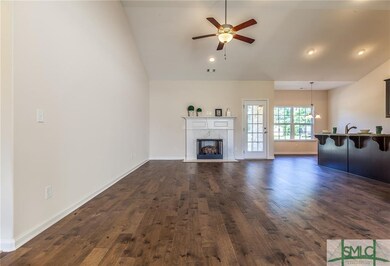 View of LR fireplace, kitchen island, and breakfas