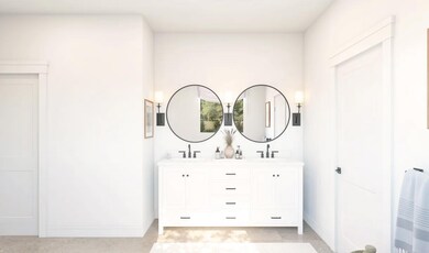 Primary bath featuring freestanding vanity with dual sinks