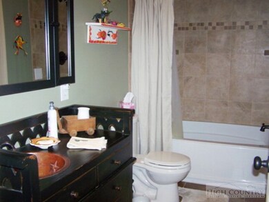 Bath 2: hallway bathroom featuring custom cabinet