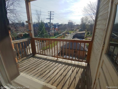 Wooden terrace featuring a residential view