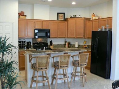 Open concept kitchen with granite counters and bla