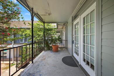 a cozy balcony with French doors leading outside.