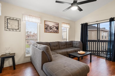Living room featuring a wealth of natural light, w