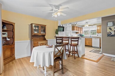 Large kitchen and dining area with sitting island between