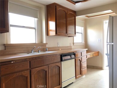 Updated kitchen with plenty of light and access to backyard