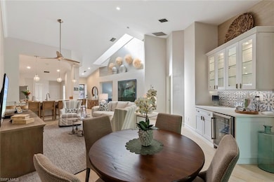 Dining room with wine cooler, high vaulted ceiling