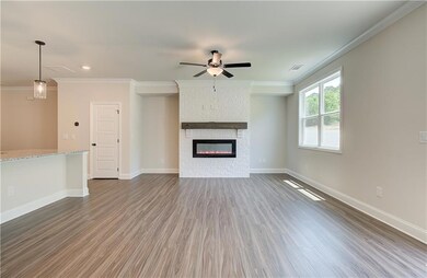 Unfurnished living room featuring visible vents, w