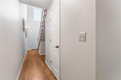 Corridor with light hardwood / wood-style flooring