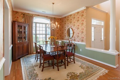 Formal dining room with chair rail and crown moldi