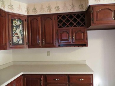 Kitchen. Note the decorative stained glass door an