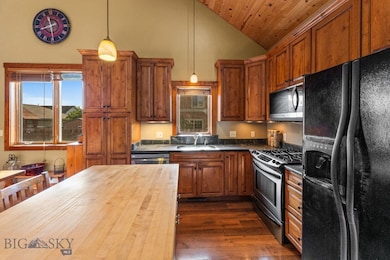Kitchen with solid surface countertops & butcher b