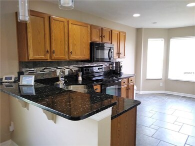 Kitchen has granite counter tops--eat in space als
