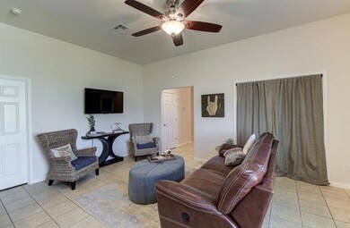 Living room featuring light tile patterned floors