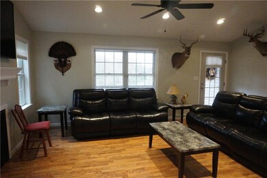 View of living room from dining room.  Front Entry