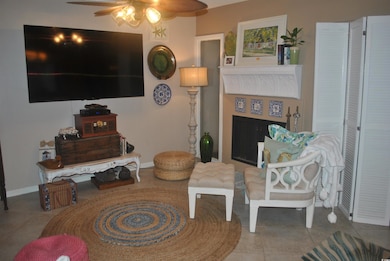 Tiled living room with ceiling fan