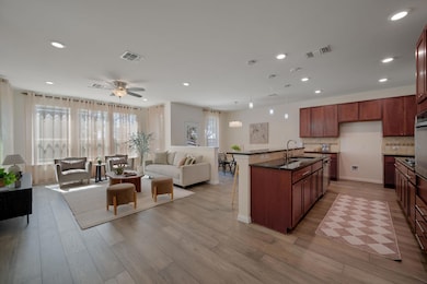 Kitchen with open floor plan, light wood-type flo