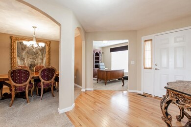 The hardwood floor entry welcomes access to numero