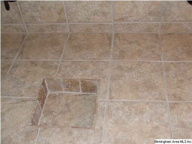 tumbled marble shower surround in guest baths