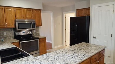 Kitchen with granite counter tops & recessed light