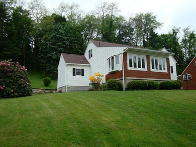 Exterior Front. Three season room added for additi