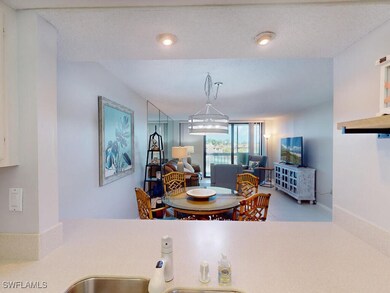 Tiled dining space with a textured ceiling