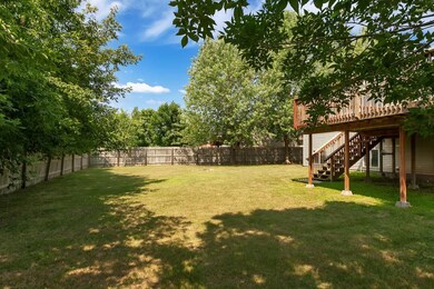 Fully fenced in backyard and mature trees offer a 