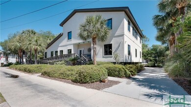 Parking driveways flank each side of the house and