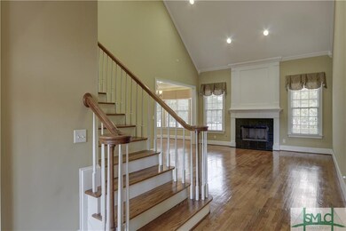 A view to the living room showing the elegant stai