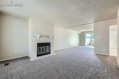 Unfurnished living room with baseboards, visible v