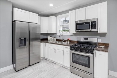 New kitchen w/ stainless steel appliances