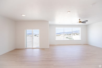 View of spacious dining area and family room from kitchen.