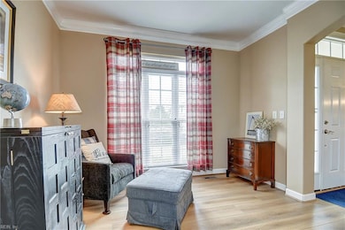 Living room to the right of the foyer upon entering.