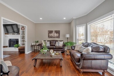 Living room featuring wood finished floors, recess