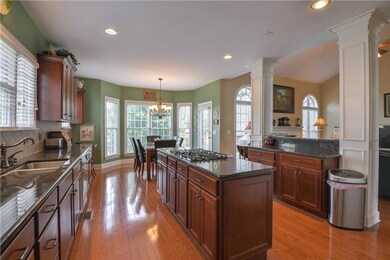 Huge kitchen with granite counters and island. Lots of cabinets. Measures 24 x 13 (eat-in)