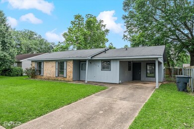 Ranch-style house with fence, a shingled roof, a c