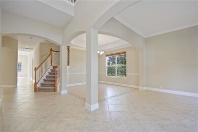 Two story Foyer w/Living Room & Dining Room to rig