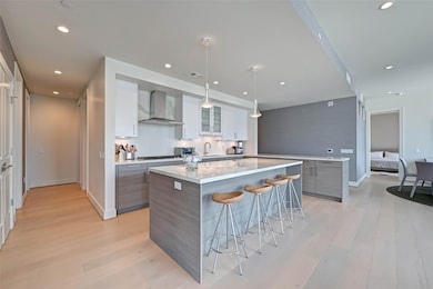 As you step into unit 1101 you are greeted by the elegant living dining room and kitchen.