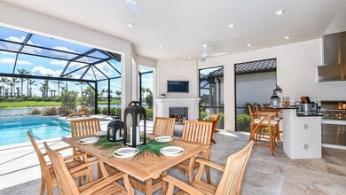 View of patio featuring outdoor dining area, a fireplace, an outdoor kitchen, and ceiling fan